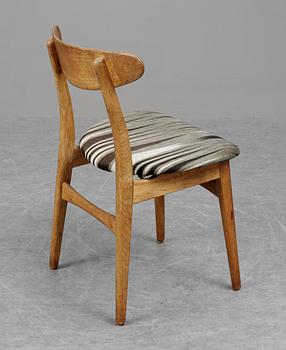 A set of six Hans J Wegner CH-30 oak and teak chairs by Carl Hansen, Denmark.