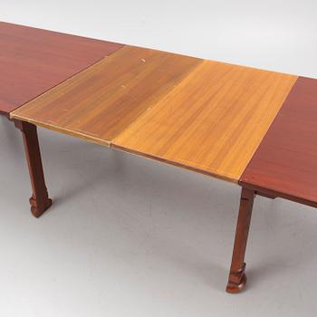 A mahogany and oak dining table, second half of the 20th century.