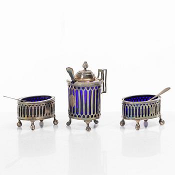 Two silver salt cellars, and a mustard pot, French hallmarks, late 18th Century.
