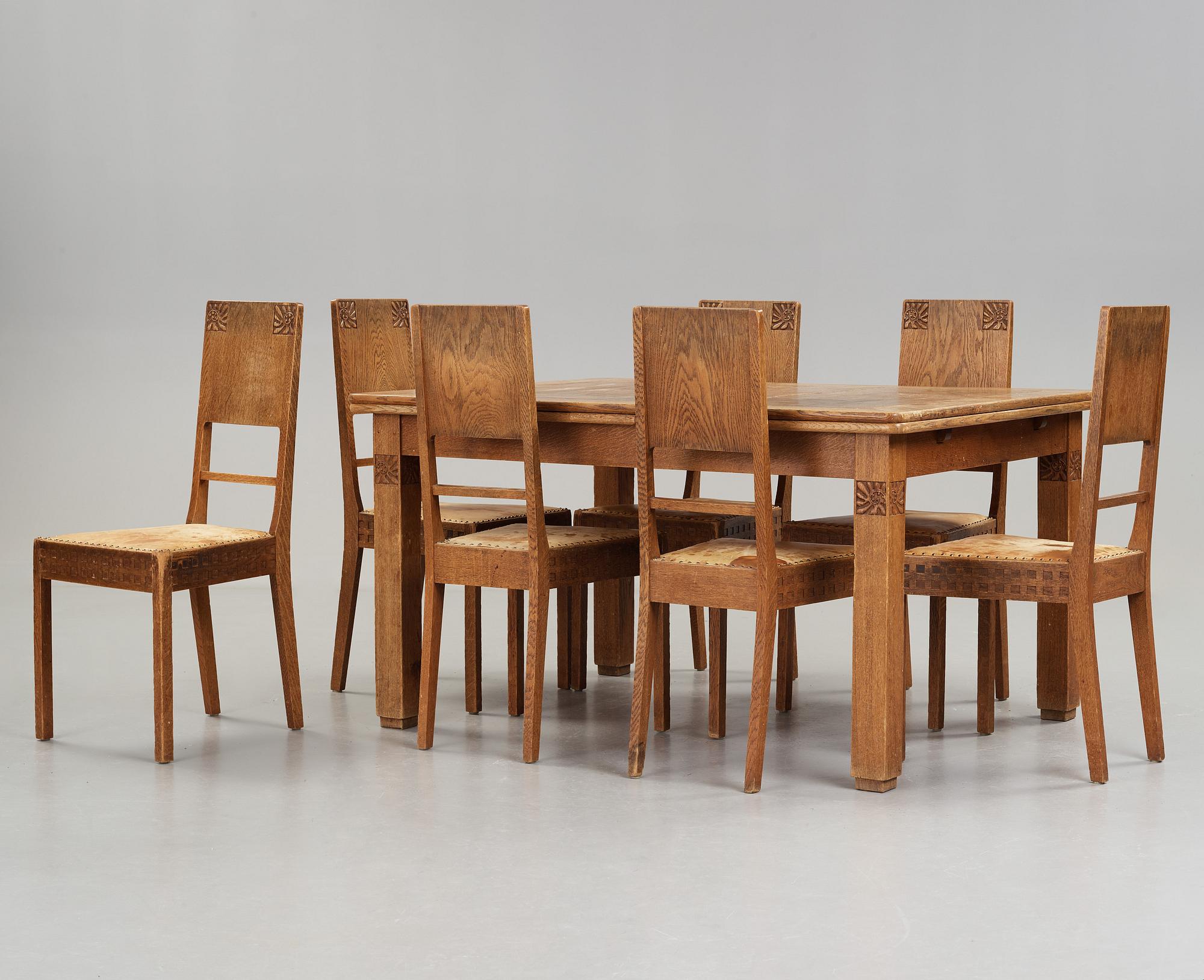 A Art Nouveau oak set with dining table, seven chairs and a side table, Finland, early 1900's.