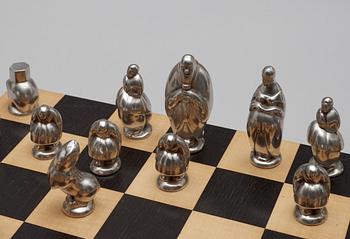 A set of chess; 32 pewter and pacel gilt pewter,  by Svensk Tenn.