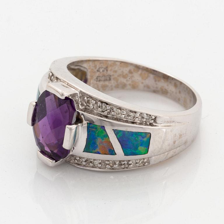 Checker-cut amethyst, opal and diamond ring.