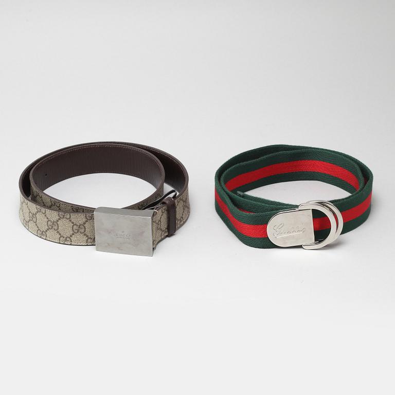 Two Gucci belts.