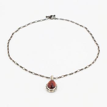 A Georg Jensen silver and cabochon-cut amber necklace.