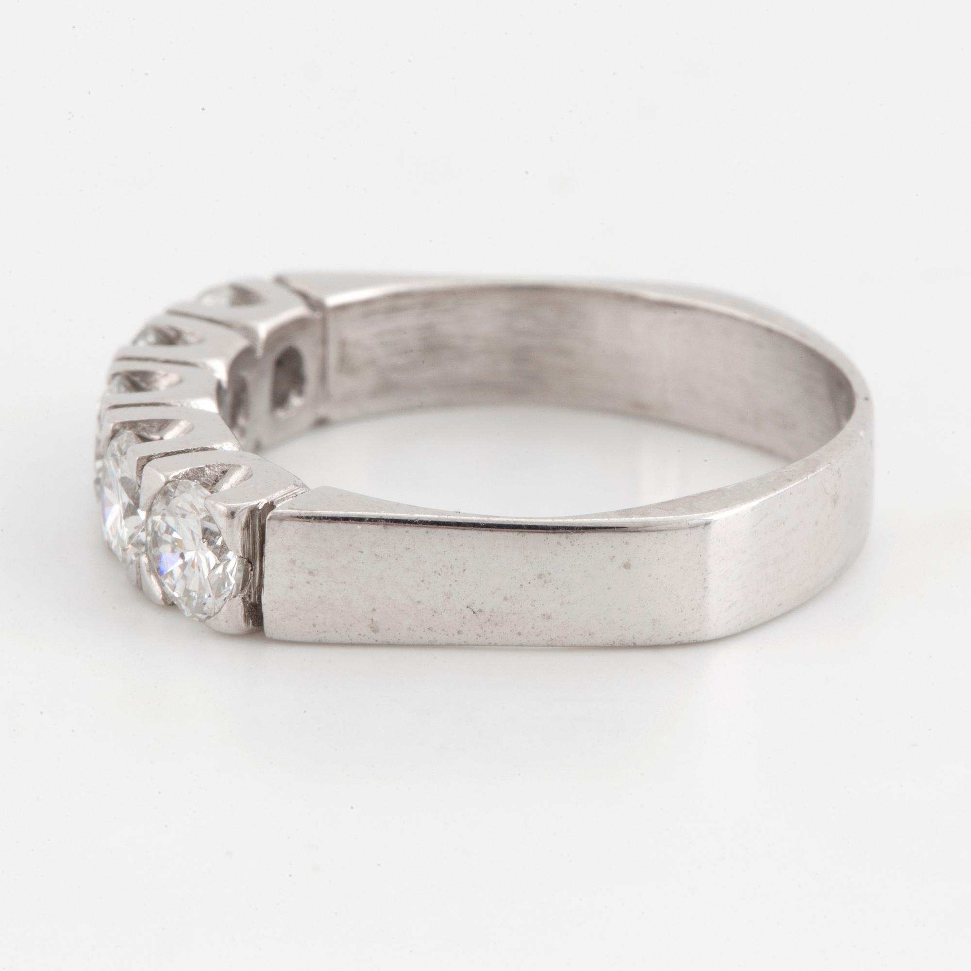 A half-eternity 18K white gold diamond ring.
