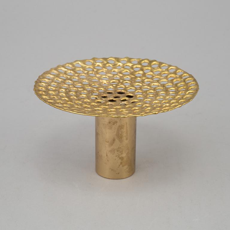 a brass vase by Pierre Forsell for Skultuna.