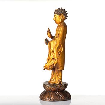 A lacquer figure of a standing Buddha, late Ming dynasty/early Qing dynasty.