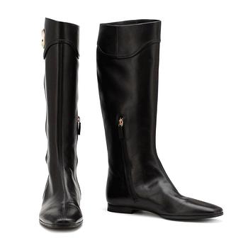 GUCCI, a pair of black leather boots.