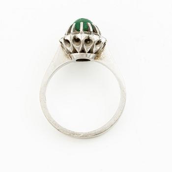 Ring, 18K white gold with cabochon-cut emerald and brilliant-cut diamonds.
