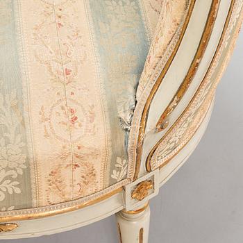 A Gustavian style sofa and table from early 20th century.