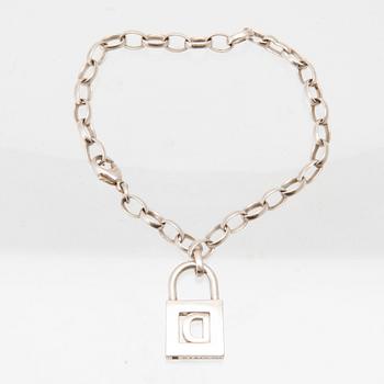 Tiffany & Co a silver pendant with accompanying bracelet.