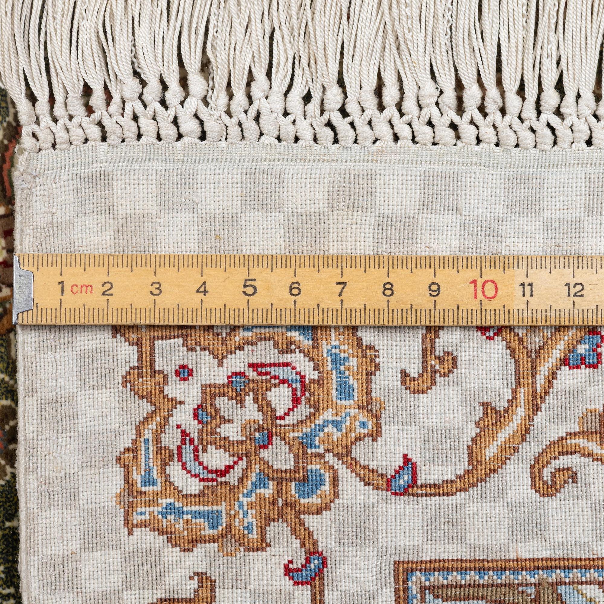 A silk Qum, Central Persia. signed Mohammad Gamshidi, c. 203 x 126 cm.