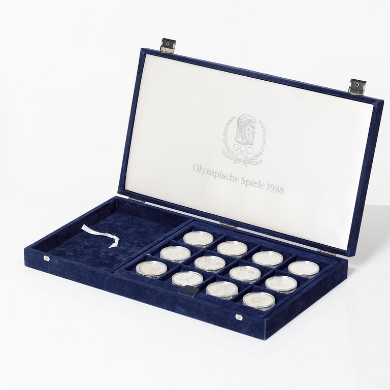 Twelve commemorative sterling silver coins, Olympic Games, Calgary and Seoul, 1988.