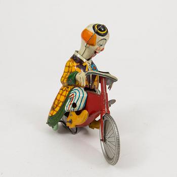 A tinplate Technofix bicycling clown Germany c. 1950.