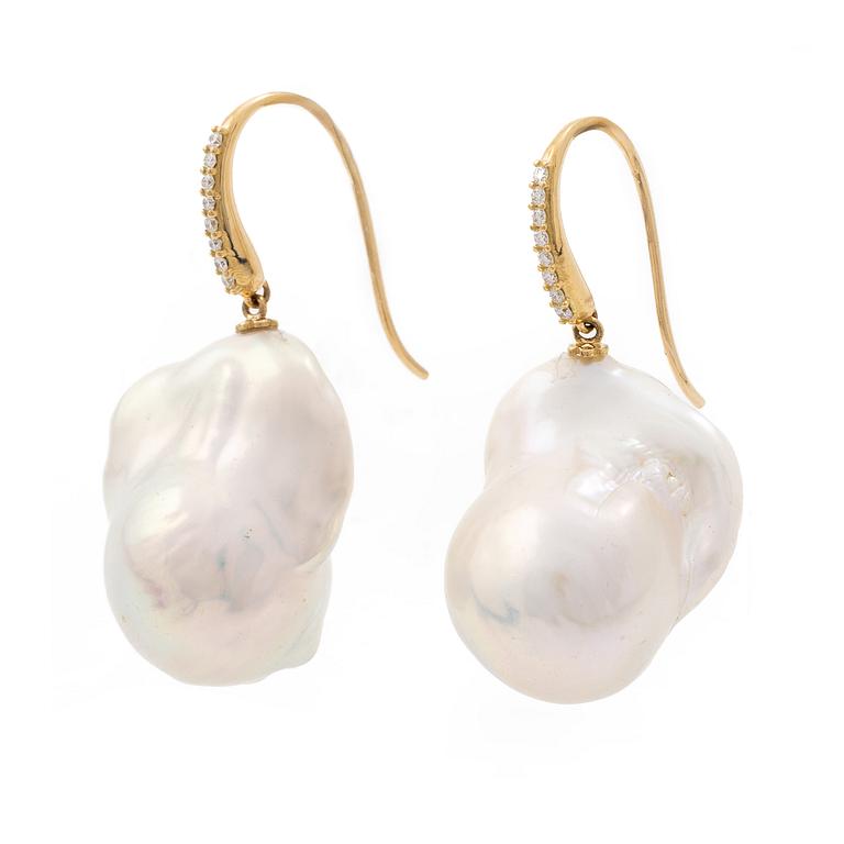 A pair of earrings with cultured baroque-shaped freshwater pearls and round brilliant-cut diamonds.