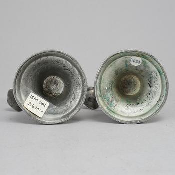 A pair of 19th century pewter candlesticks.