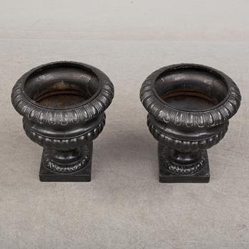 A pair of cast iron plant pots. Late 20th century.