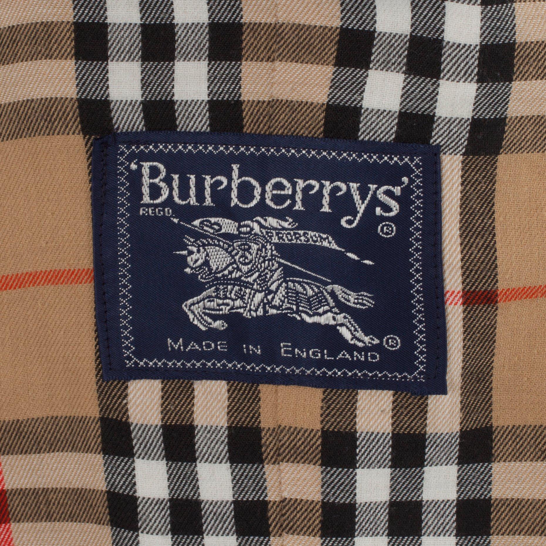 BURBERRY, a beige cotton blend trenchcoat and a shawl.