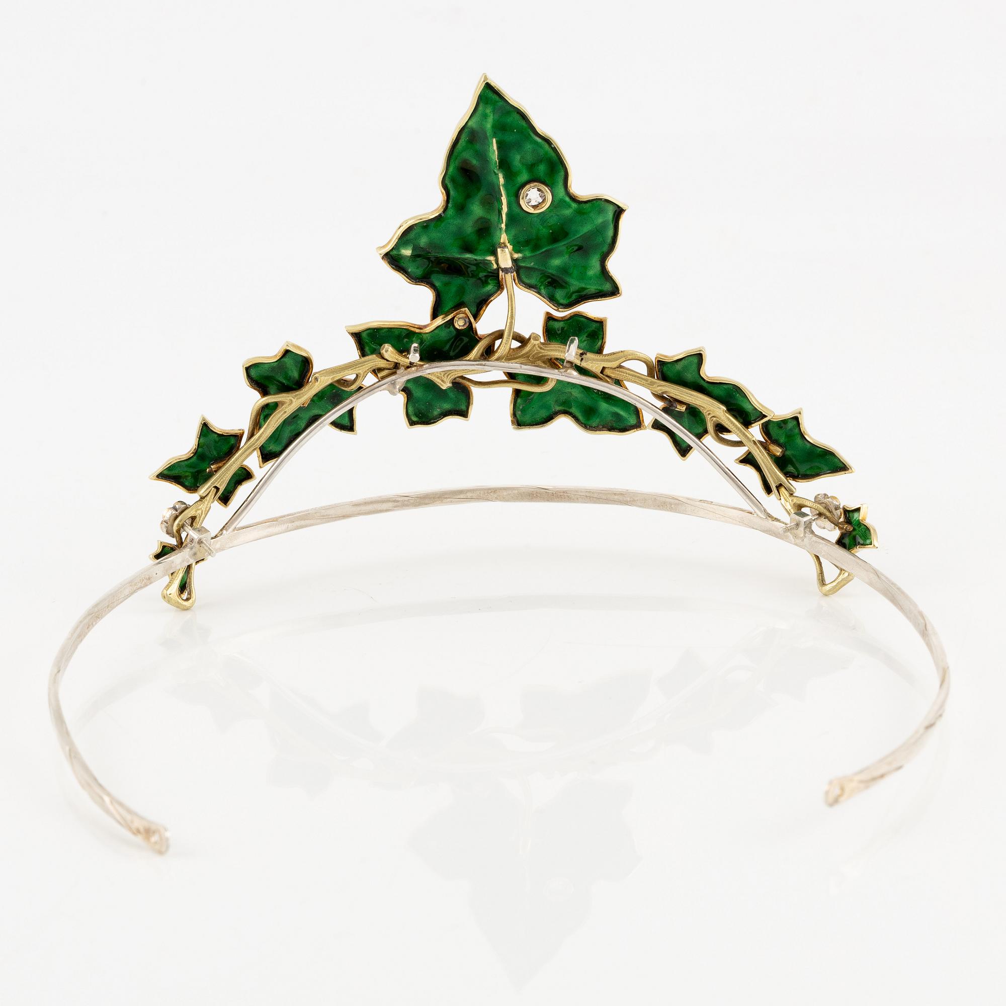 A necklace/tiara combination in 18K gold and green enamel set with old-cut diamonds.