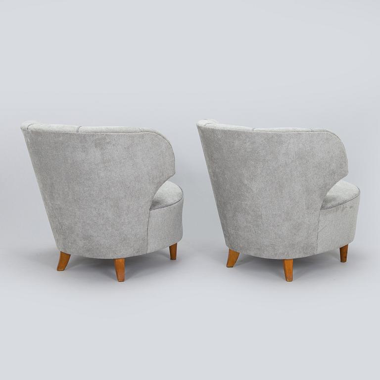 A pair of mid 20th century armchairs.
