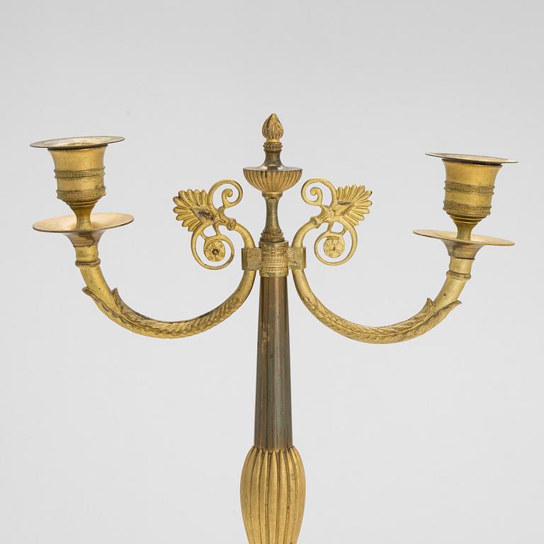 A pair of brass candelabra, early 20th century.