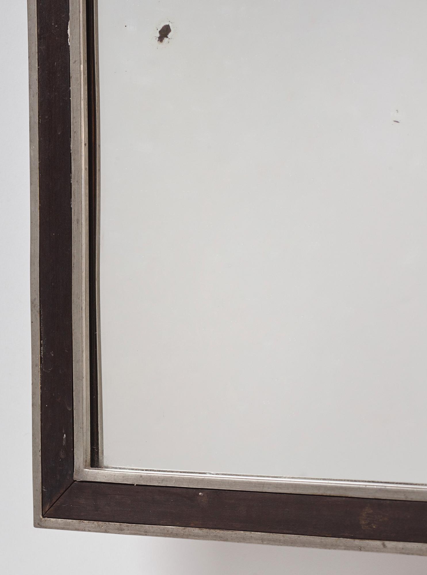 Uno Åhrén, a rare ebonized pear wood and pewter mirror, Firma Svenskt Tenn, early 1930s.