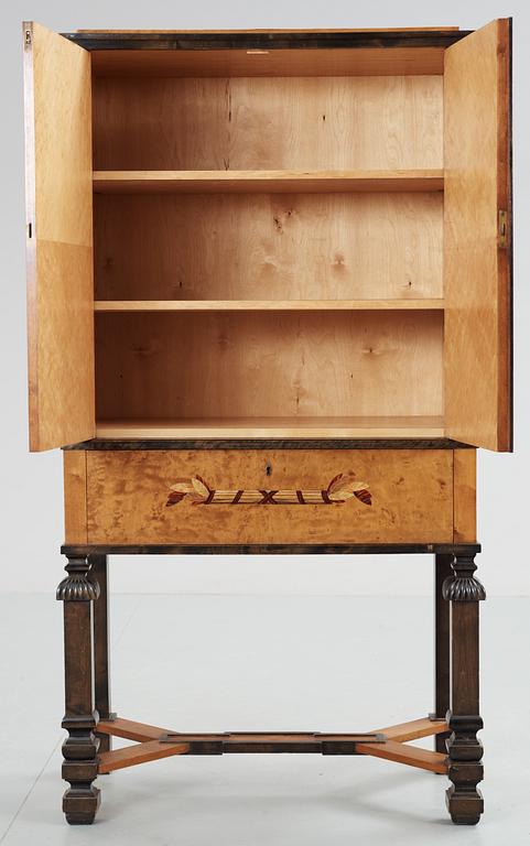 A Carl Malmsten birch cabinet with inalys of different coloured woods, probably by NK, circa 1925.