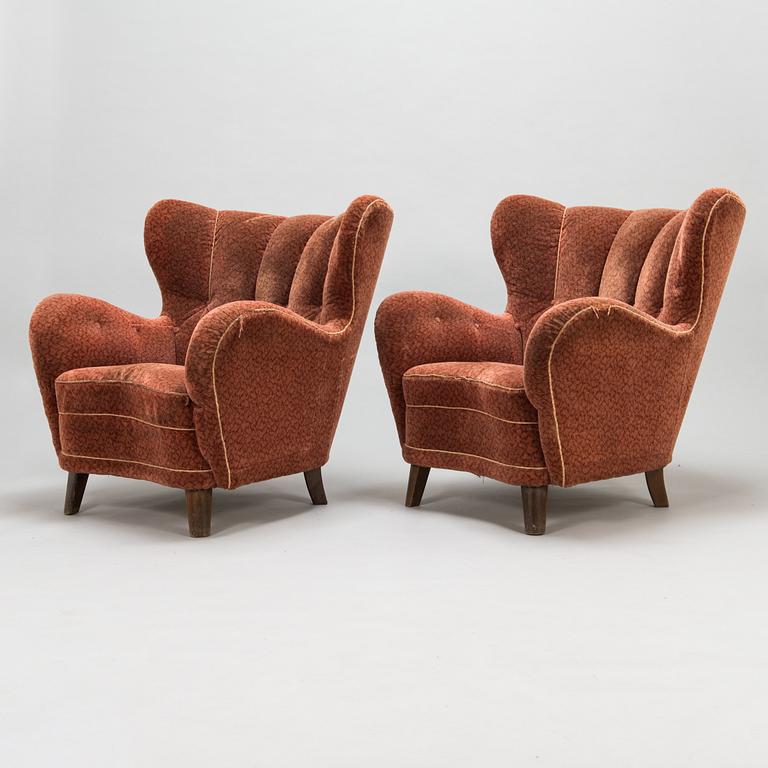 A pair of mid 20th Century armchairs.