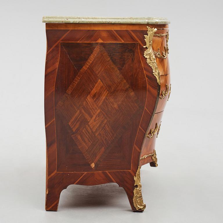 A rococo parquetry and ormolu-mounted commode attributed to L. Nordin (master 1743-1773).