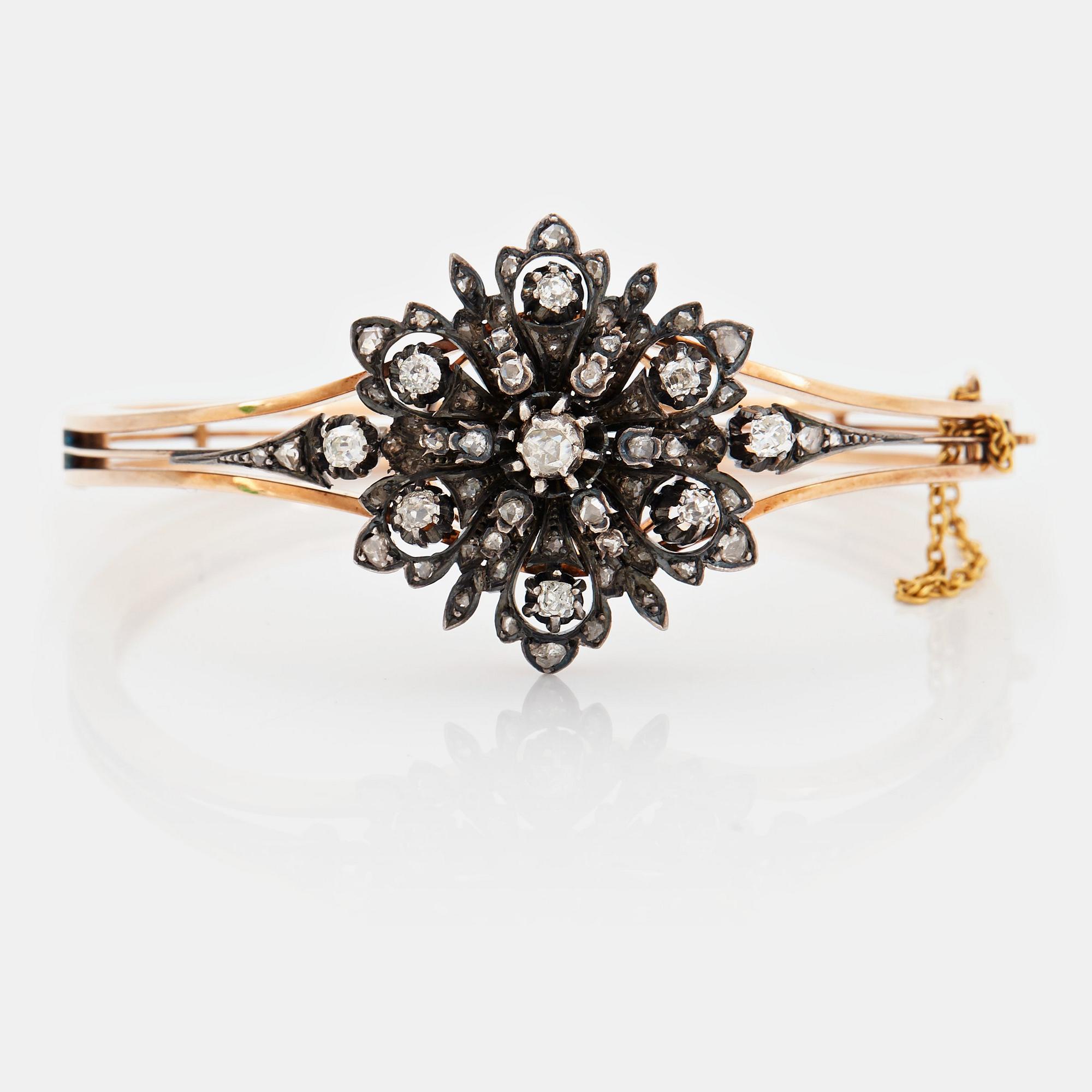 A 14K gold and silver bangle set with old- and rose-cut diamonds.