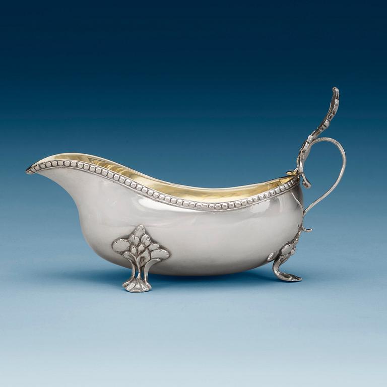A Swedish 18th century parcel-gilt cream-jug, makers mark of Lars Hessling, Linköping 1778.