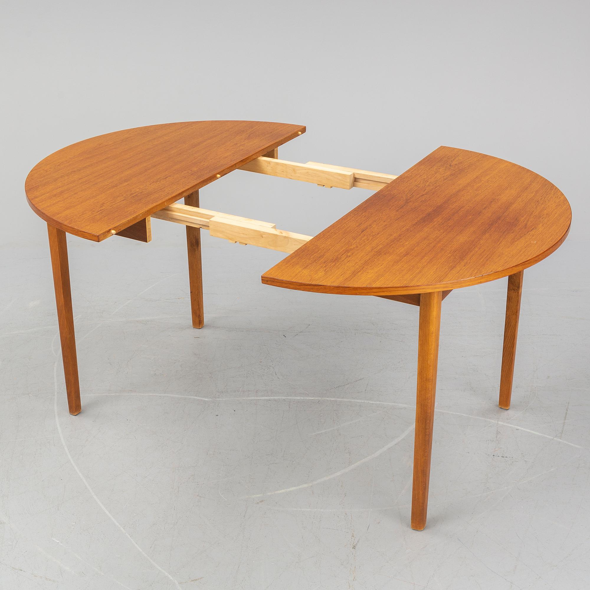 A teak veneered table, second half of the 20th century.