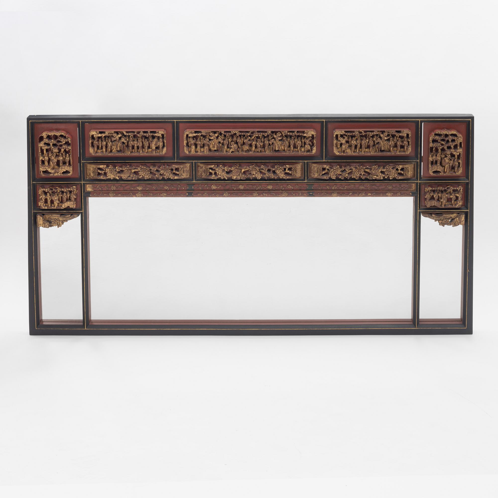 A Chinese gilt and lacquer wooden mirror, 20th century.