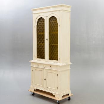 A modern painted display cabinet.