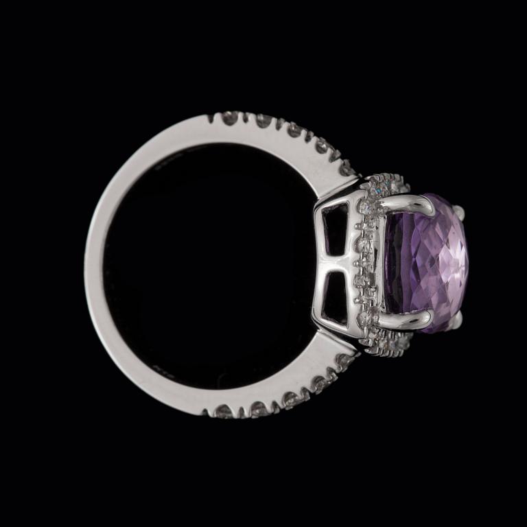 A 4.50 ct amethyst and 0.55 ct diamond ring.