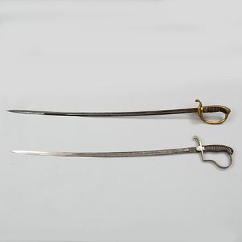 Two Swedish sabres, end of the 19th Century, with scabbards.