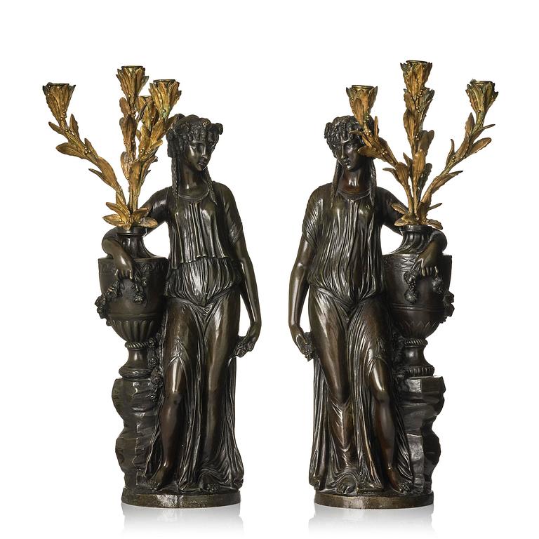 A pair of Louis XVI-style four-light gilt and patinated bronze candelabra after Clodion, later part 18th century.
