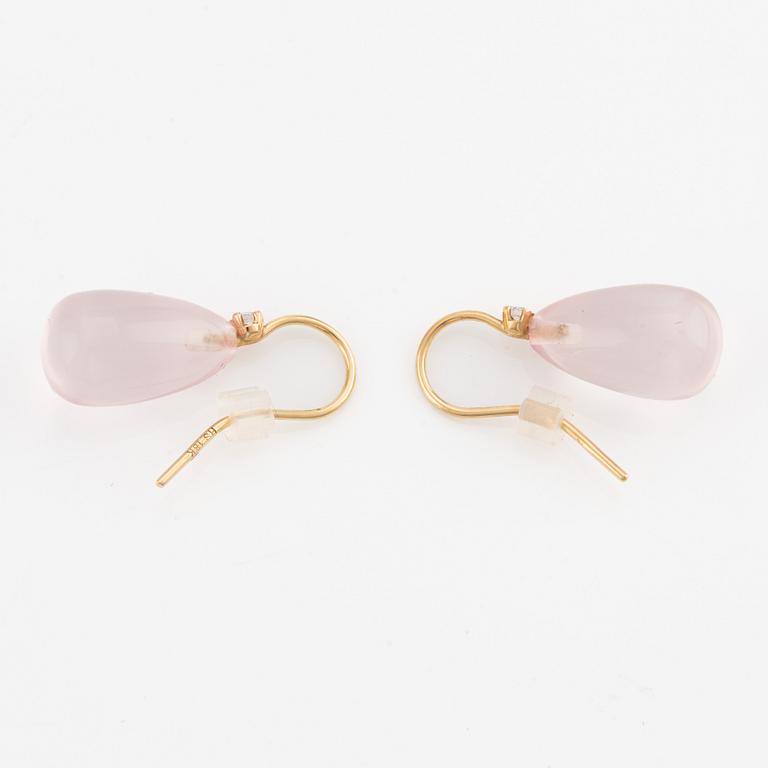 A pair of 18K gold earrings with rose quartz and round brilliant-cut diamonds.