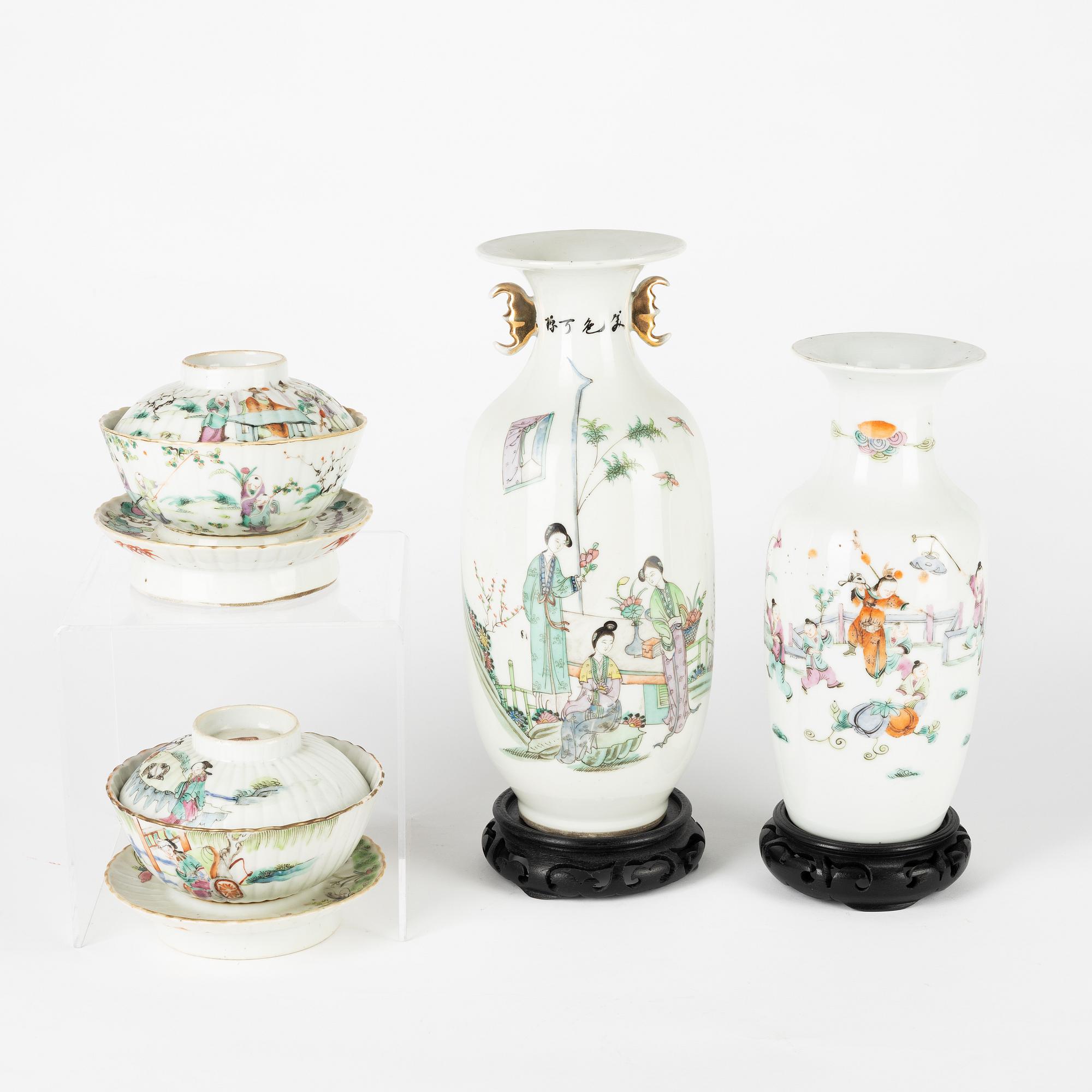 A set of two Chinese famille rose vases and two cups with covers and stands, late Qing dynasty/early 20th Century.