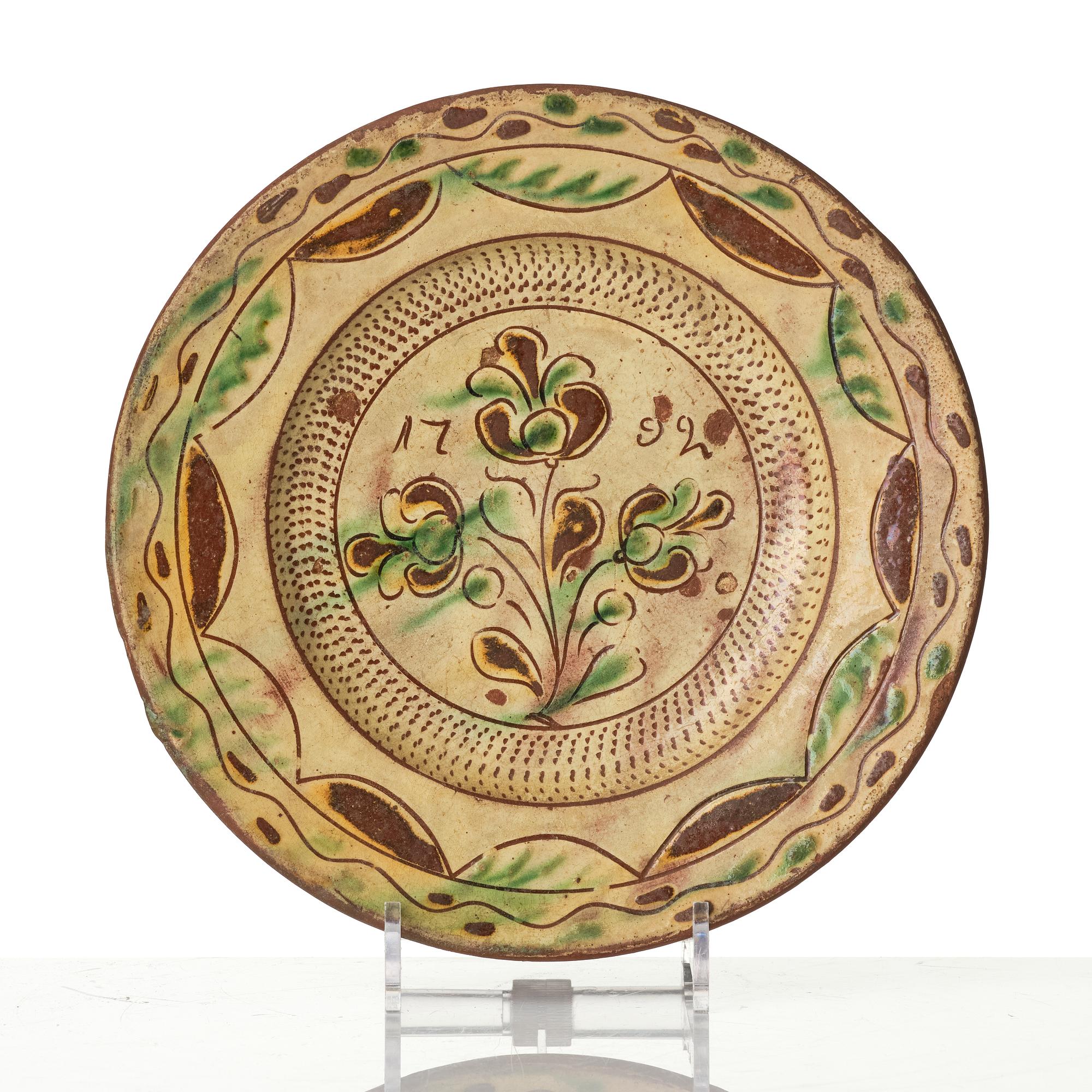 An earthenware dish, dated 1792.