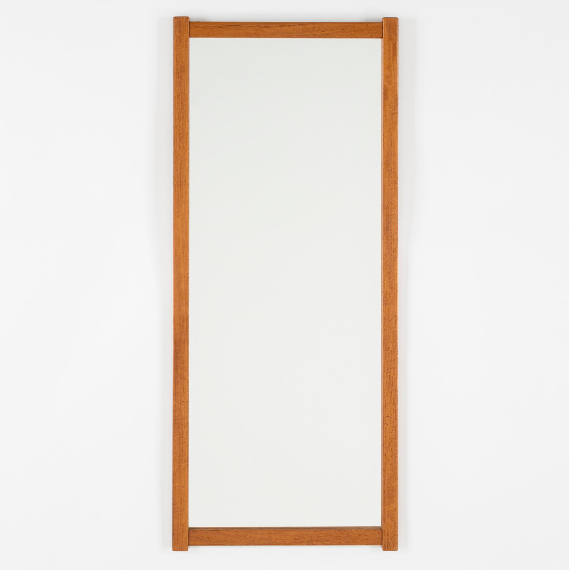 A Swedish teak mirror, Fröseke Nybrofabriken, 1950s / 60s. Signed with label.