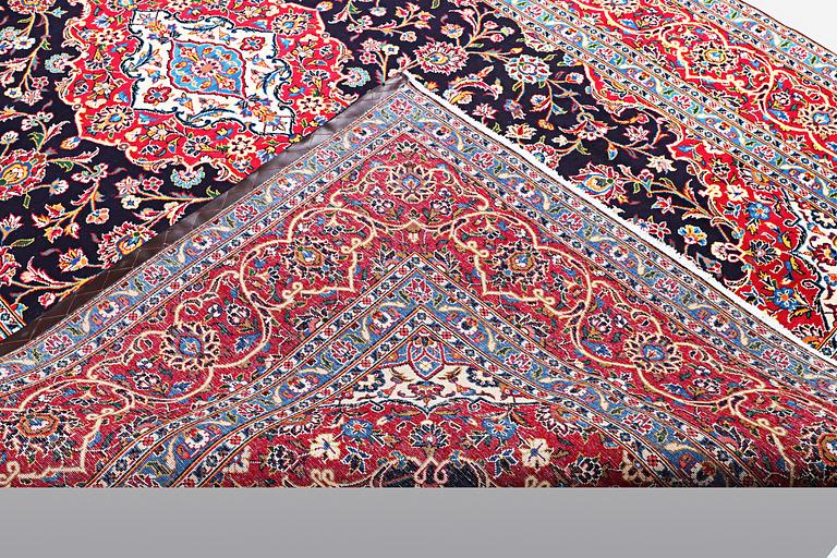 A carpet, Kashan signed Najafi, ca 360 x 231 cm.