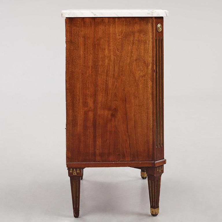 A late Gustavian mahogany, brass-mounted and marble-top commode by C. G. Foltiern (master in Stockholm 1804-29).