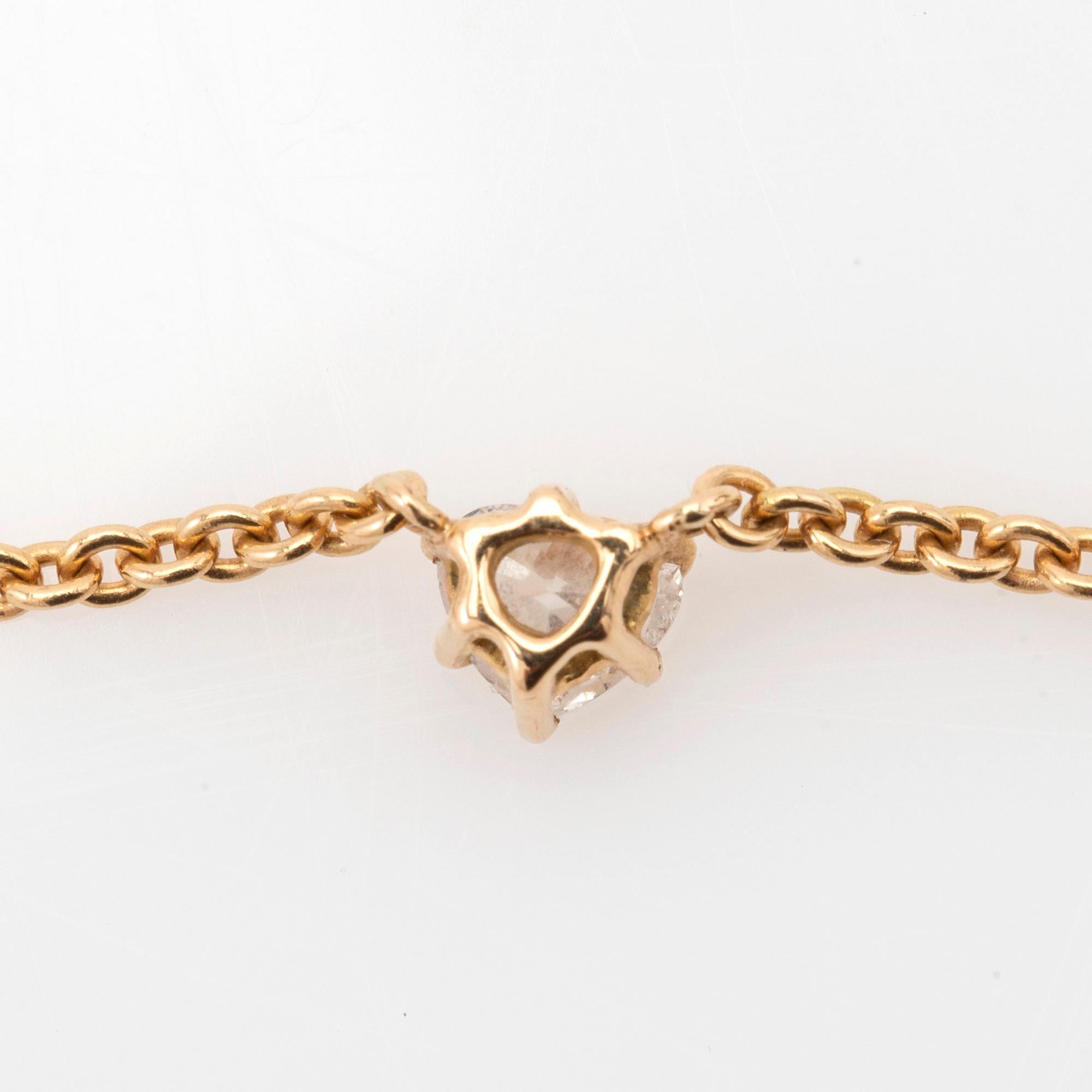 Necklace, 18K gold with heart-shaped diamond.