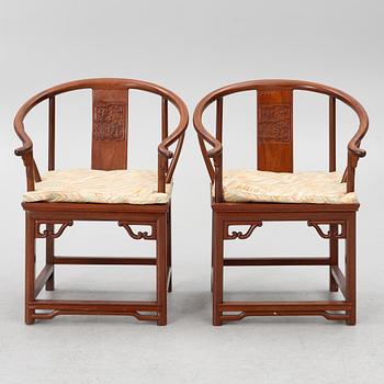 A pair of hardwood 'horse shoe back' hardwood armchairs, Hong Kong, 1960s.