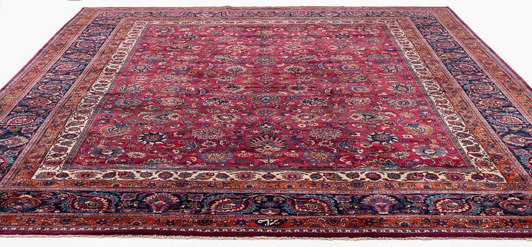 A Mashad carpet, signed Saber, c. 459 x 348 cm.