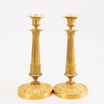 A pair of Empire brass candle sticks mid 1800s.