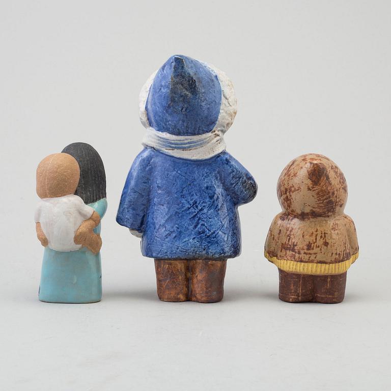 LISA LARSON, a set of three stoneware figurines, "North" and "East", 1974 and "Four years", 1977, Gustavsberg, Sweden.