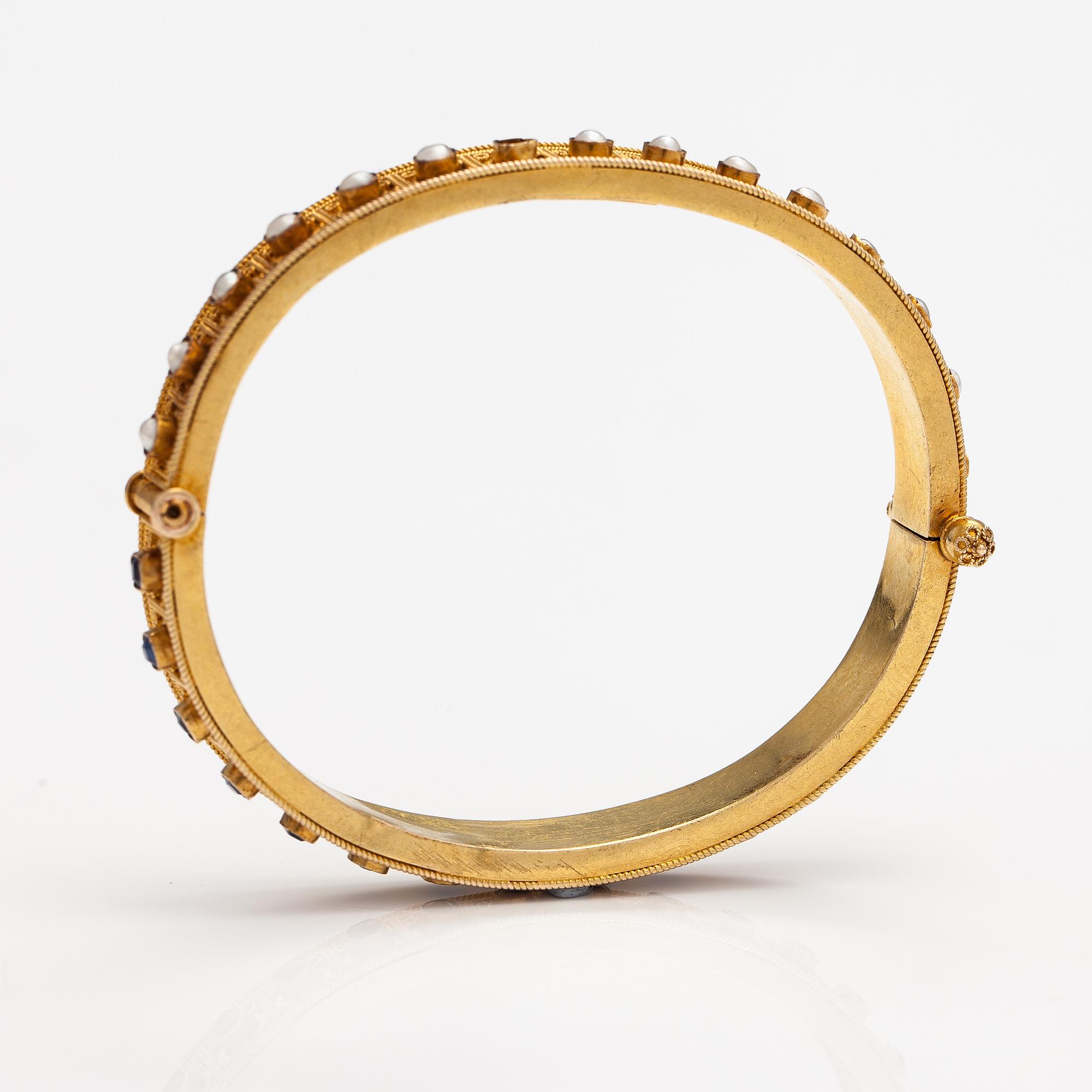 A ca. 22K gold bracelet with sapphires and pearls. Marchesini, Firenze Roma.