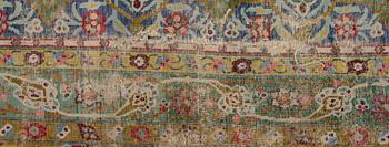 A PERSIAN CARPET. Early 20th century. Ca 687x470 cm.